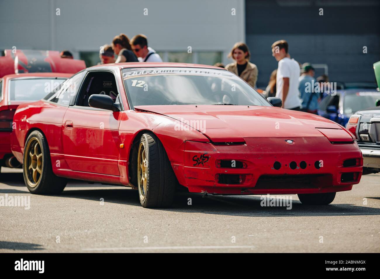 KYIV-28 JULY,2019: JDM car show outdoor.Tuned Japanese drift cars expo in  summer.Lowered Nissan 240SX car in red paint Stock Photo - Alamy