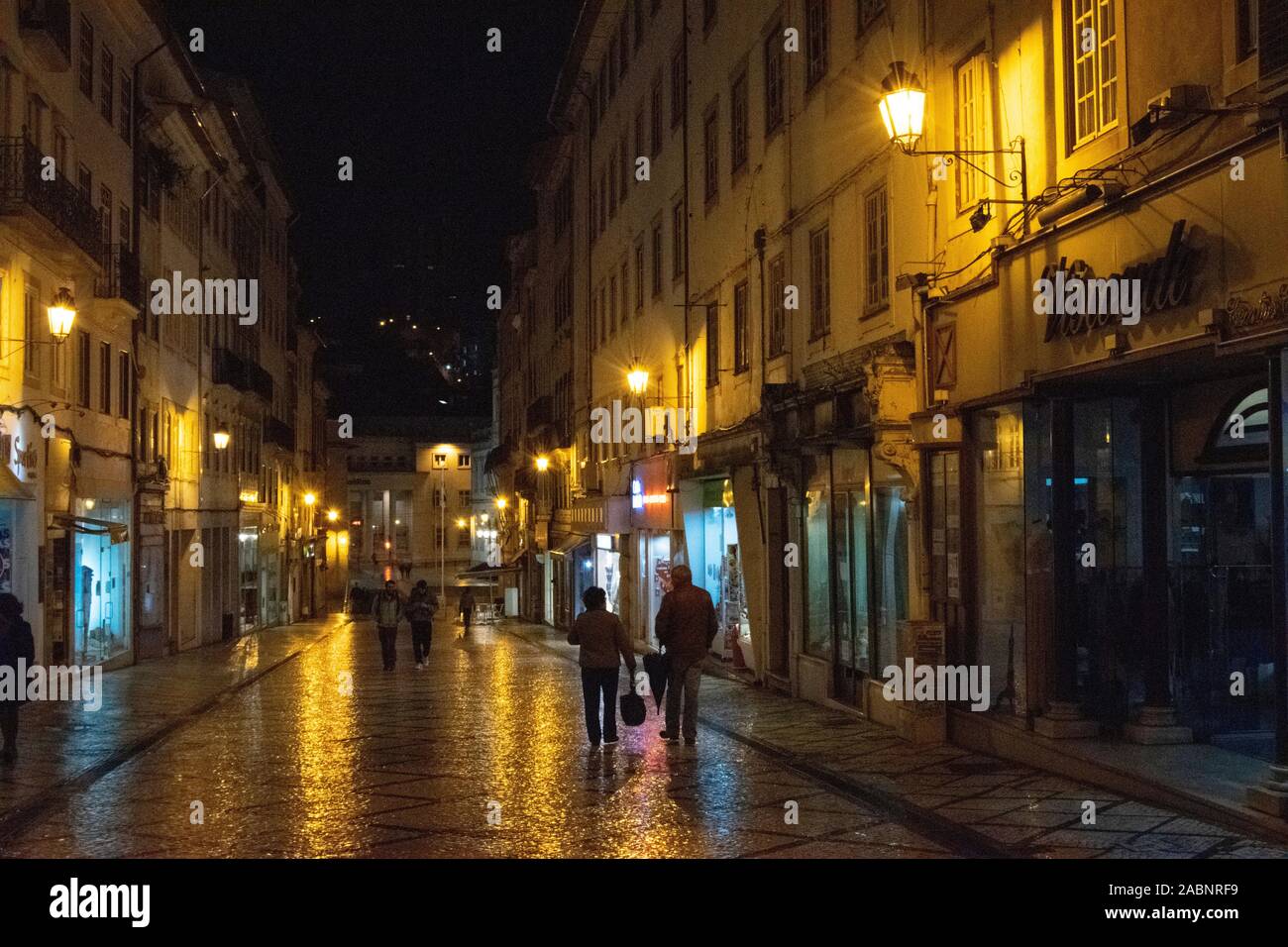 Night street scene on Rua Visconde da Luz in Coimbra Portugal Stock Photo