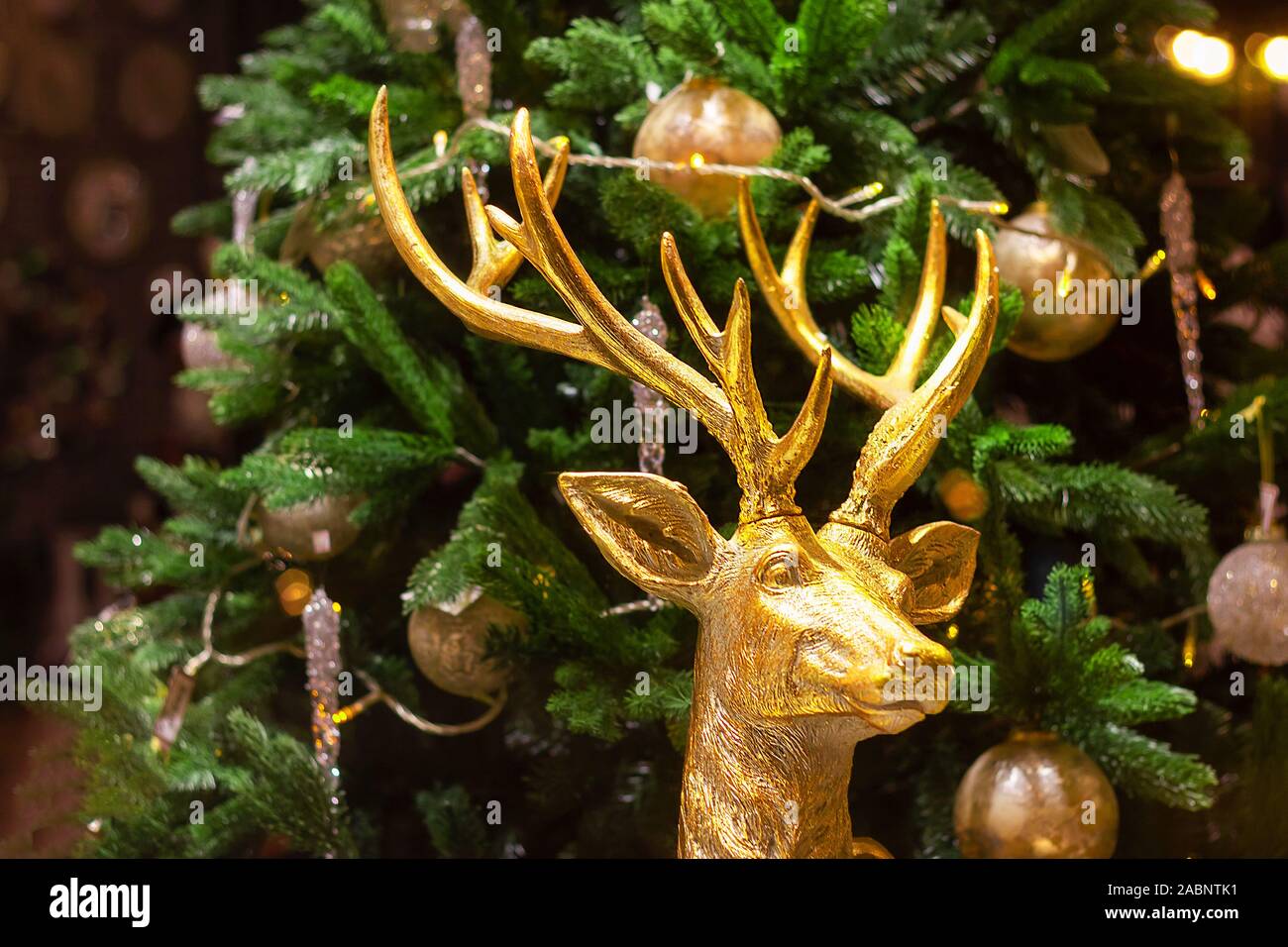 big deer in gold figurine christmas tree decor . interrior noel disign Stock Photo