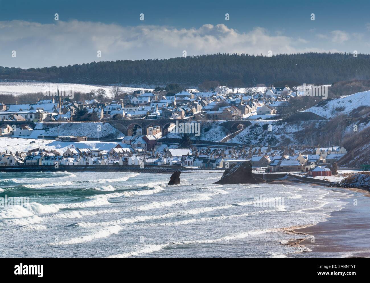 CULLEN TOWN MORAY COAST SCOTLAND WINTER SNOW ON HOUSES BEACH AND THE