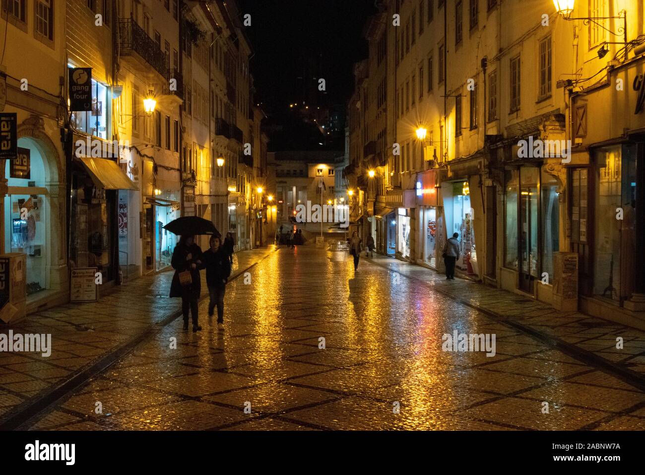 Night street scene on Rua Visconde da Luz in Coimbra Portugal Stock Photo