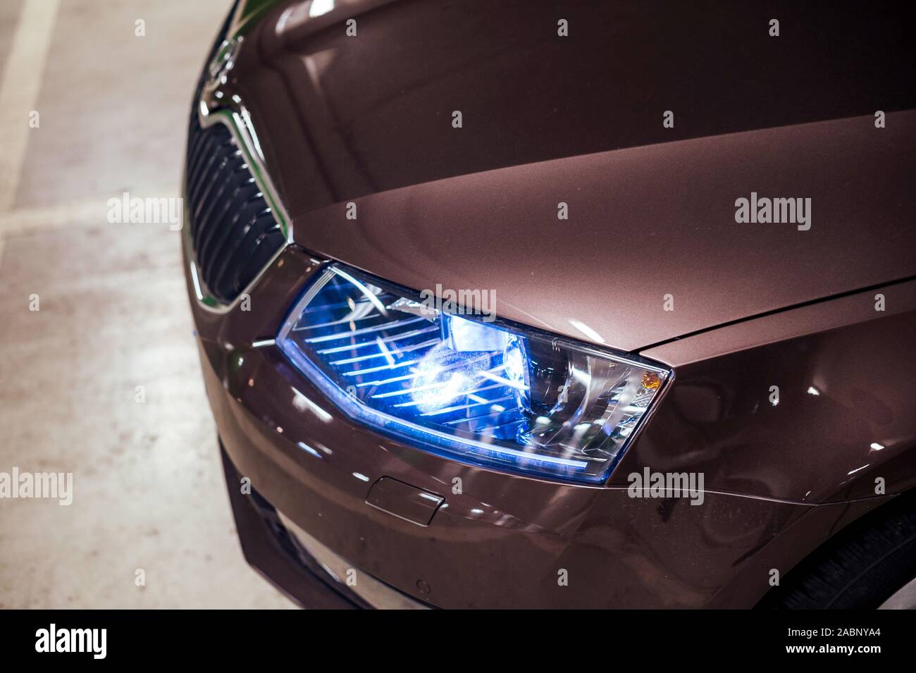 Detail of light up blue bixenon led frontlight on new luxury limousine car Stock Photo Alamy