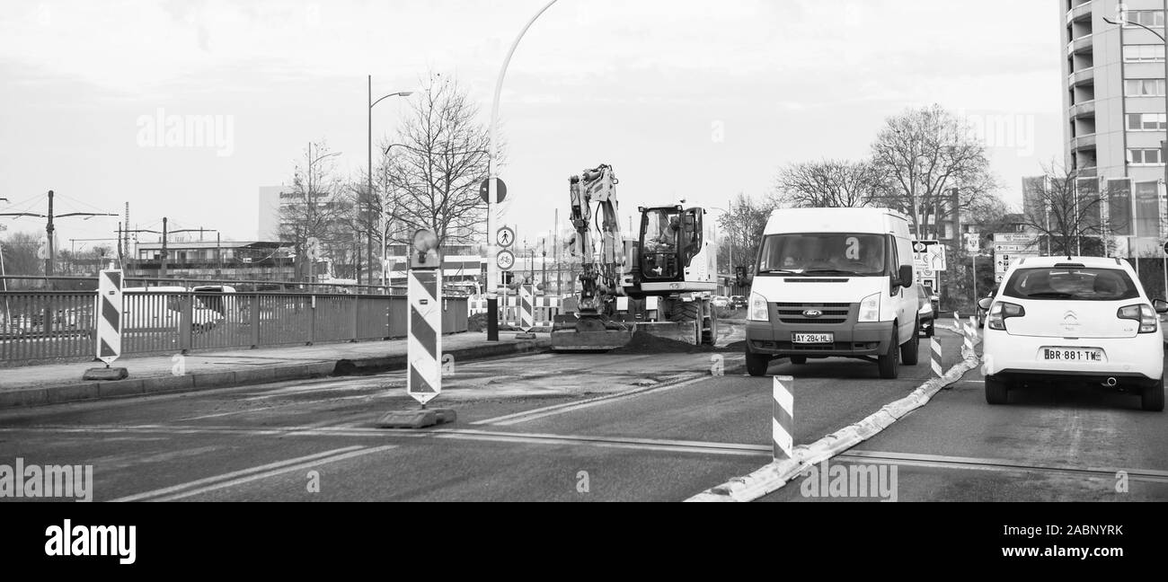 Strasbourg, France - Dec 13, 2016: Border between France and Germany with cars driving on one land during roadworks - black and white image Stock Photo