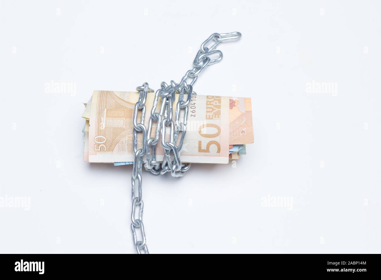 slaves and chained to money, either due to debts acquired with banks or with mortgages; the business of leaving money at high interest rates; the nece Stock Photo