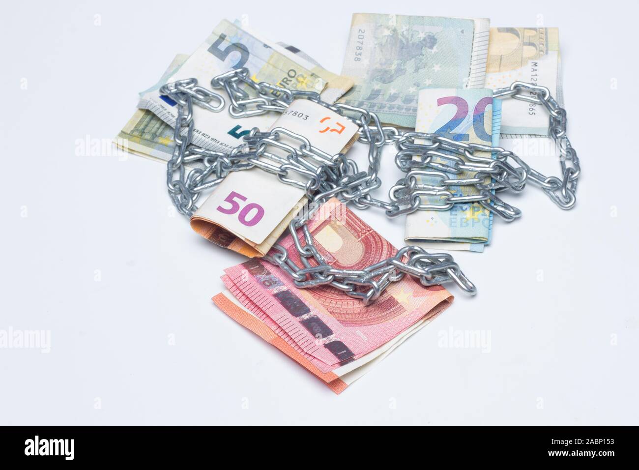slaves and chained to money, either due to debts acquired with banks or with mortgages; the business of leaving money at high interest rates; the nece Stock Photo