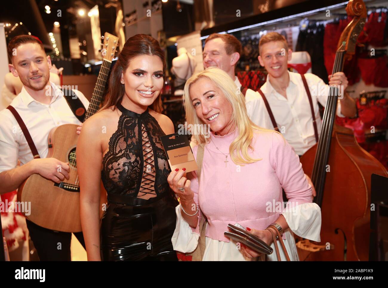 EDITORIAL USE ONLY Love Island's Megan Barton-Hanson surprises customer  Patsy Oram from Essex at Ann Summers as the face of their Black Friday  activity, at Westfield Stratford City, London Stock Photo -