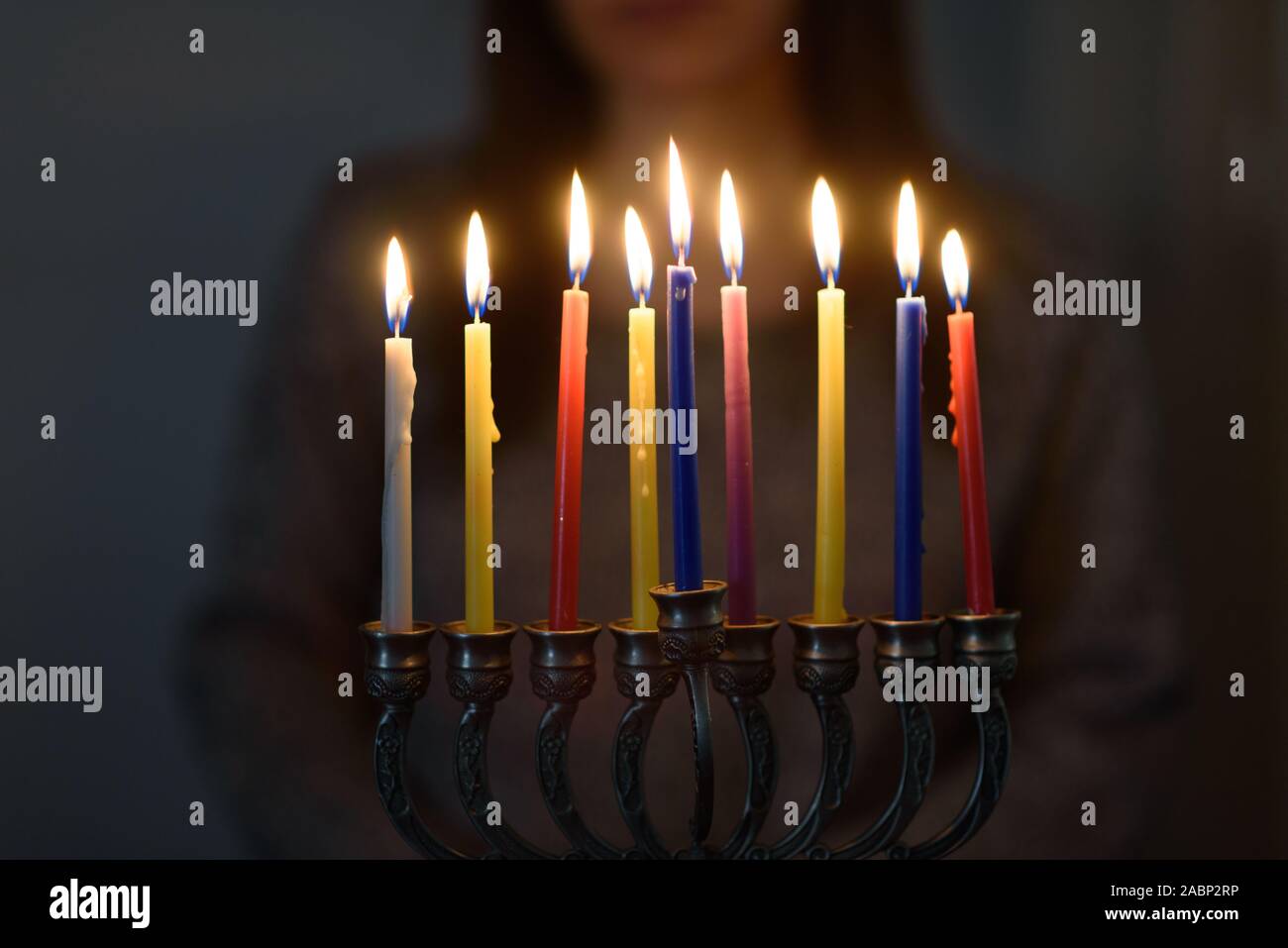 Jewish holiday Hanukkah background with menorah and colorful lighting