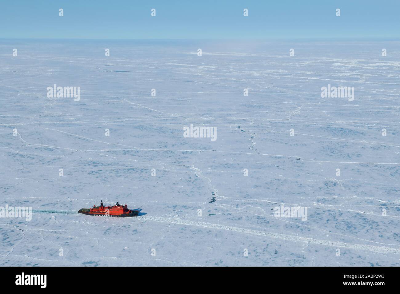 Russia. Aerial view of Russian nuclear icebreaker, 50 Years of Victory breaking throug pack ice in High Arctic at 85.6 degrees north on the way to the Stock Photo