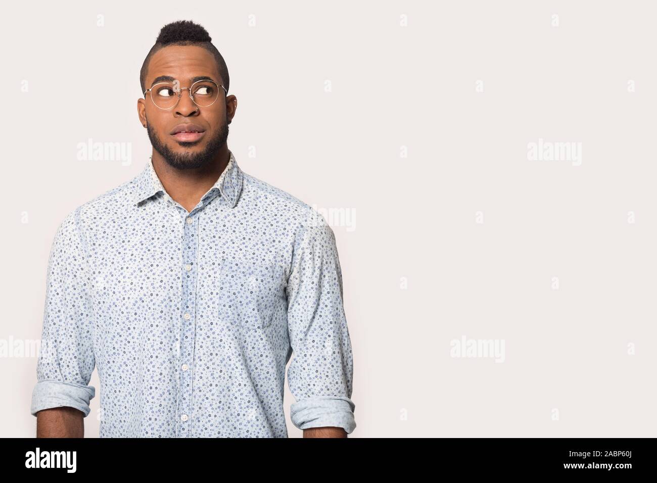 Thoughtful African American man looking aside at copy space Stock Photo