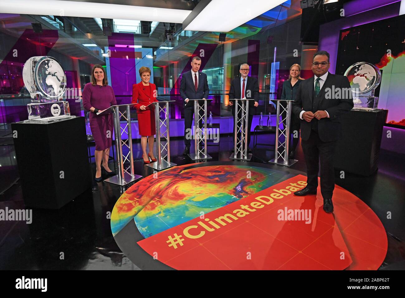 Krishnan Guru-Murthy (foreground) with (rear left to right) Liberal Democrat leader Jo Swinson, SNP leader Nicola Sturgeon, Plaid Cymru leader Adam Price and Green Party Co-Leader Sian Berry, standing next to ice sculptures representing the Brexit Party and Conservative Party who didn't appear at the event, before the start of the Channel 4 News' General Election climate debate at ITN Studios in Holborn, central London. Stock Photo