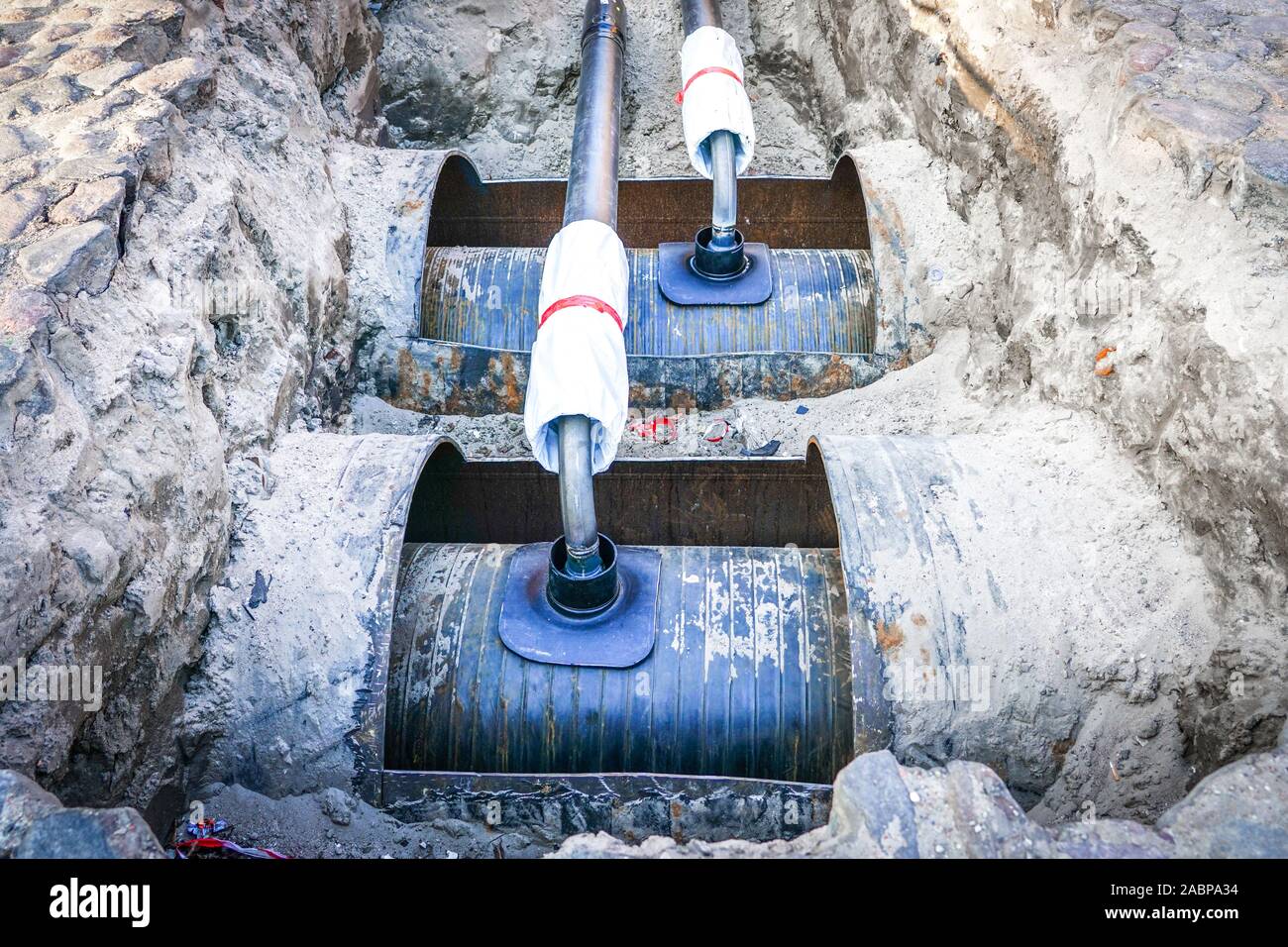 replacement of underground district heating pipes on city street Stock
