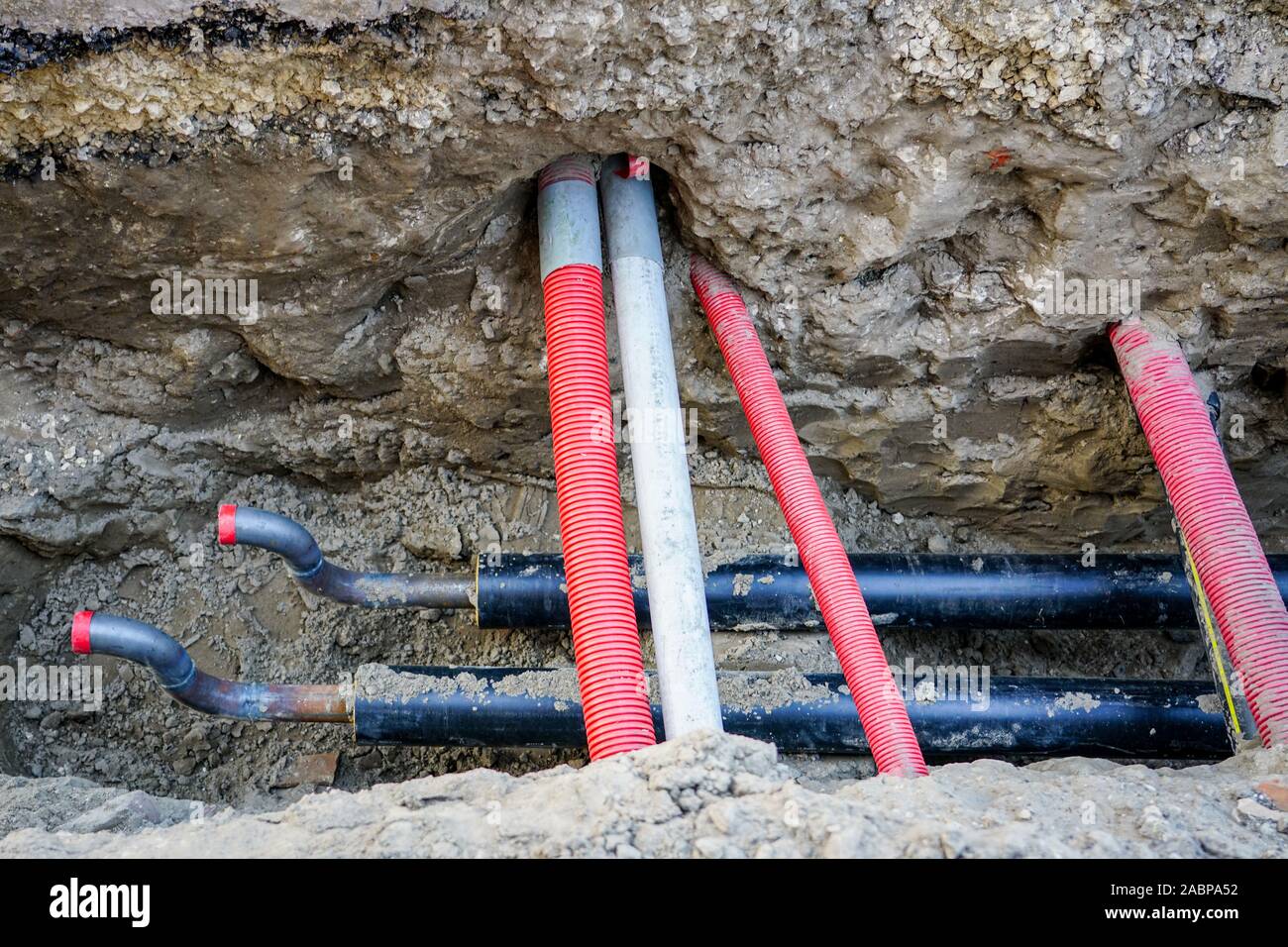replacement of underground district heating pipes on city street Stock