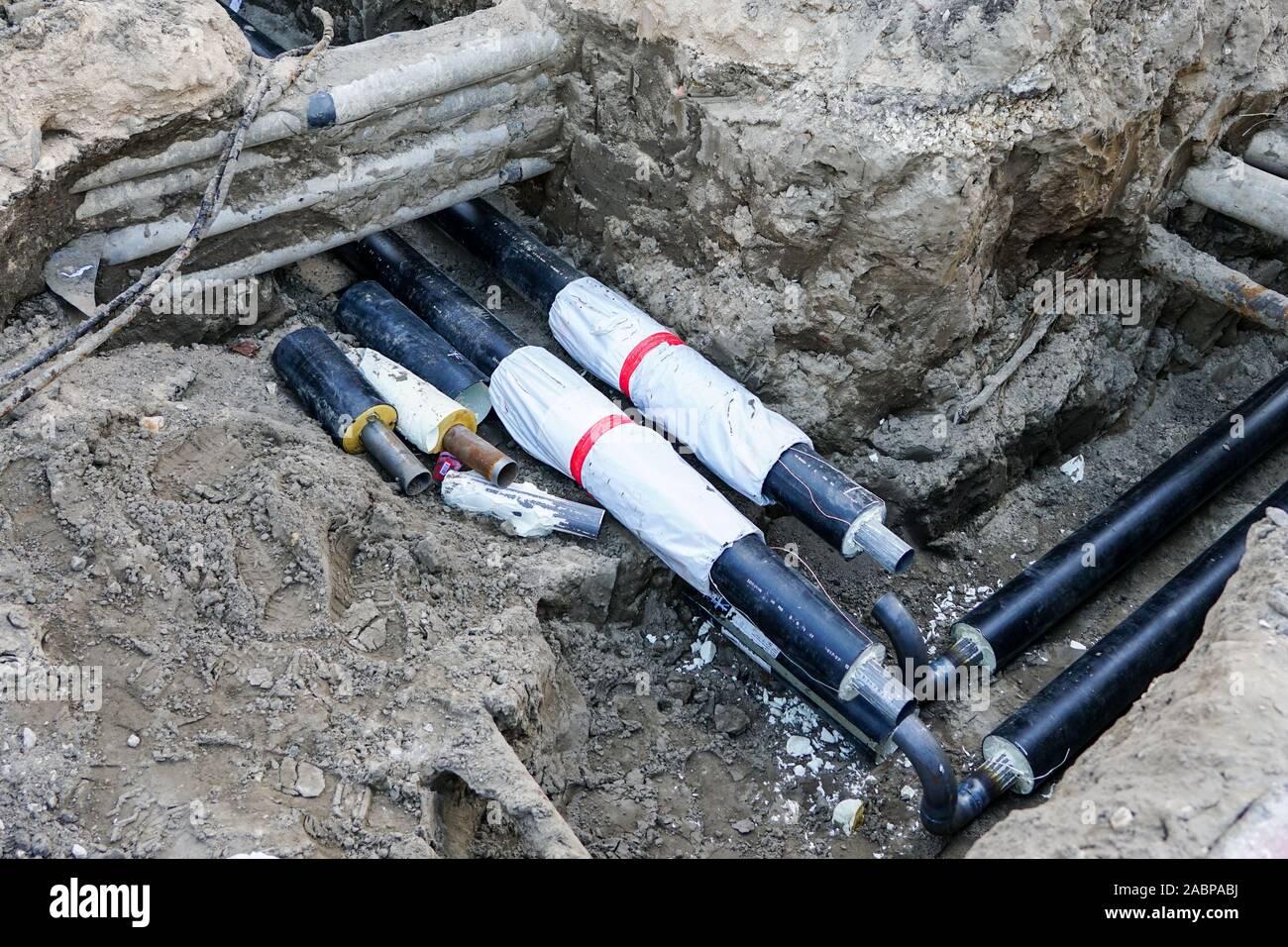 replacement of underground district heating pipes on city street Stock
