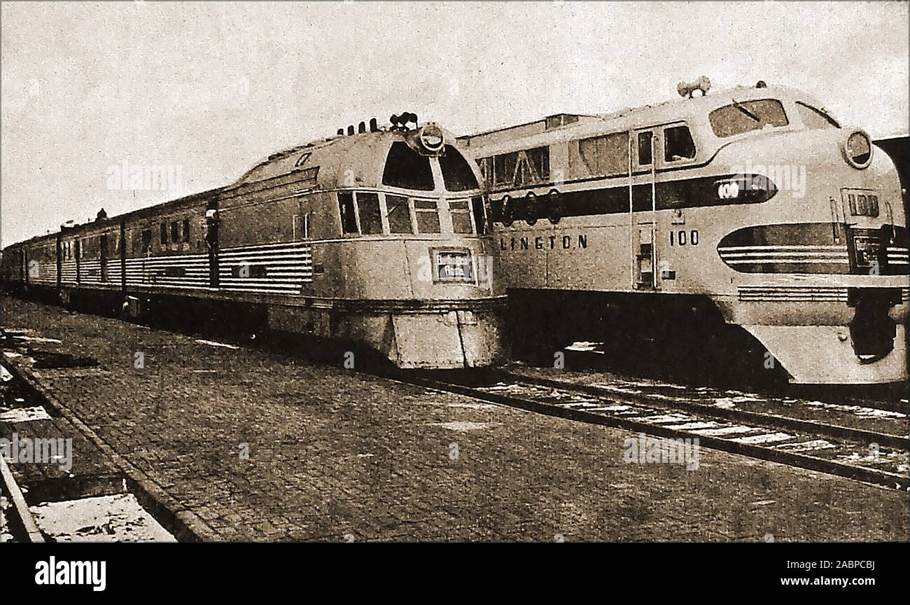 An historical  1947 photograph of 'Iron Horses' - Left is America's first streamlined diesel train (The Burlington Zephyr), and right,a 5400  Burlington goods diesel of the time. Stock Photo