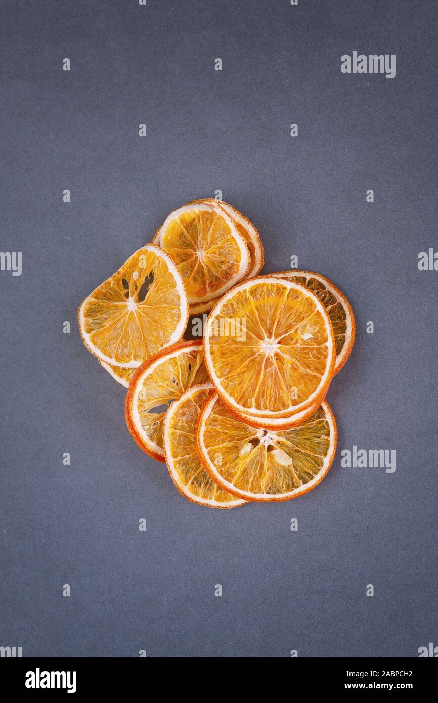 Dried oranges slices isolated on grey background, book cover template