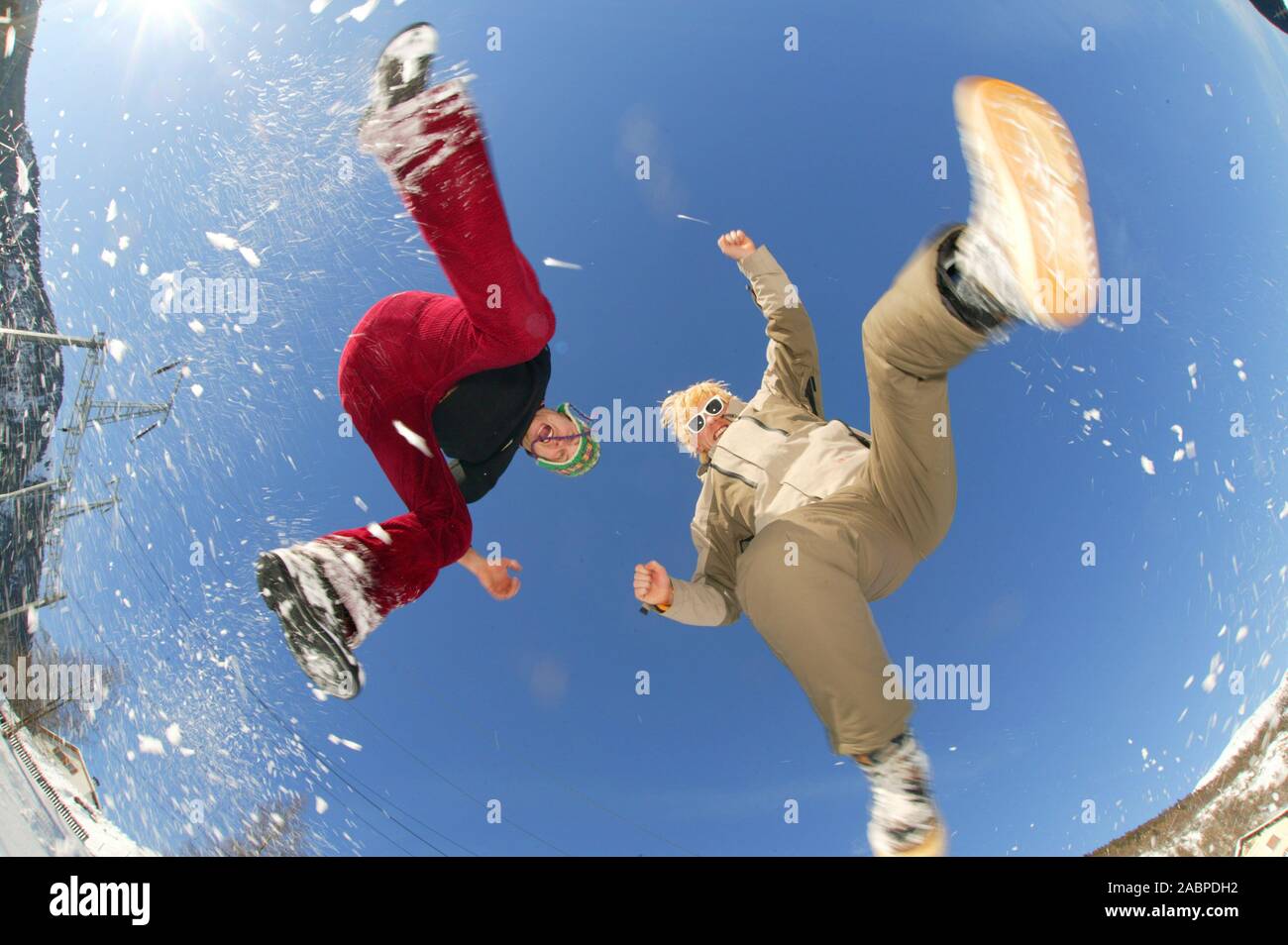Zwei Maenner springen in die Luft Stock Photo