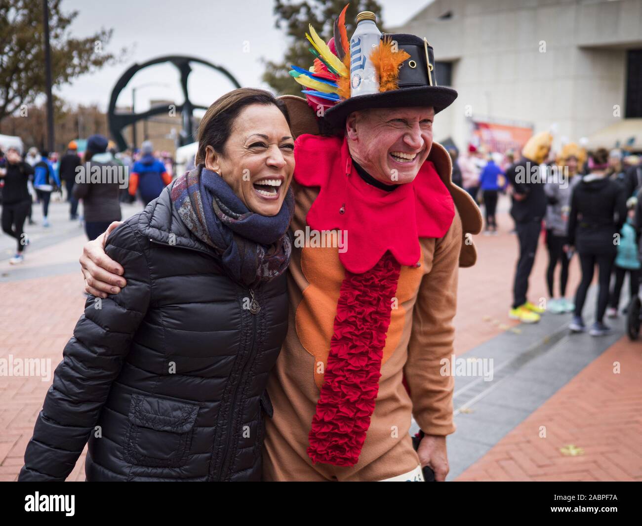 Des Moines, Iowa, USA. 28th Nov, 2019. US Senator KAMALA HARRIS (D-CA) talks to a person in a turkey outfit in the finish area of the Turkey Trot. The Turkey Trot is an annual Des Moines Thanksgiving Day 5 mile fun run. Sen. Harris greeted runners in the finish area and handed out cookies. She is running to be the Democratic nominee for the US Presidency in 2020. Iowa hosts the first selection event of the presidential election season. The Iowa caucuses are February 3, 2020. Credit: Jack Kurtz/ZUMA Wire/Alamy Live News Stock Photo