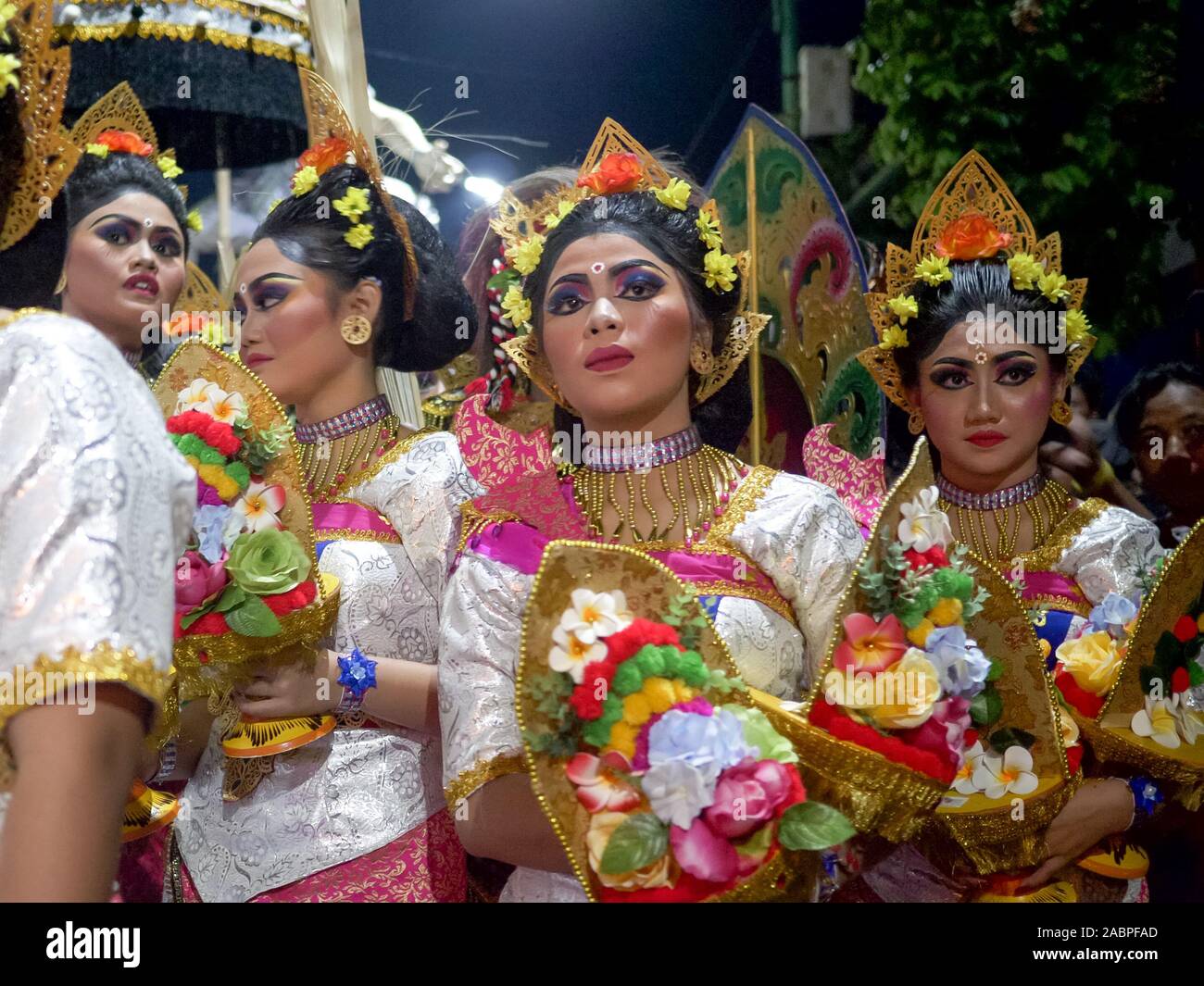 KUTA, INDONESIA - MARCH, 16, 2018: balinese girls waiting for the hindu new year parade at kuta in indonesia Stock Photo