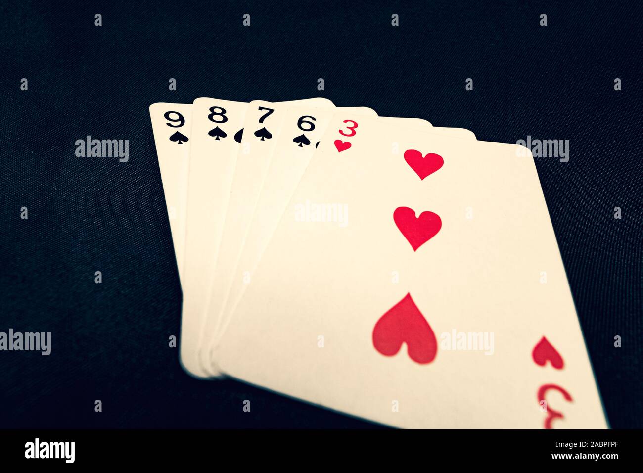 Straight flush of spades on black background Stock Photo ...