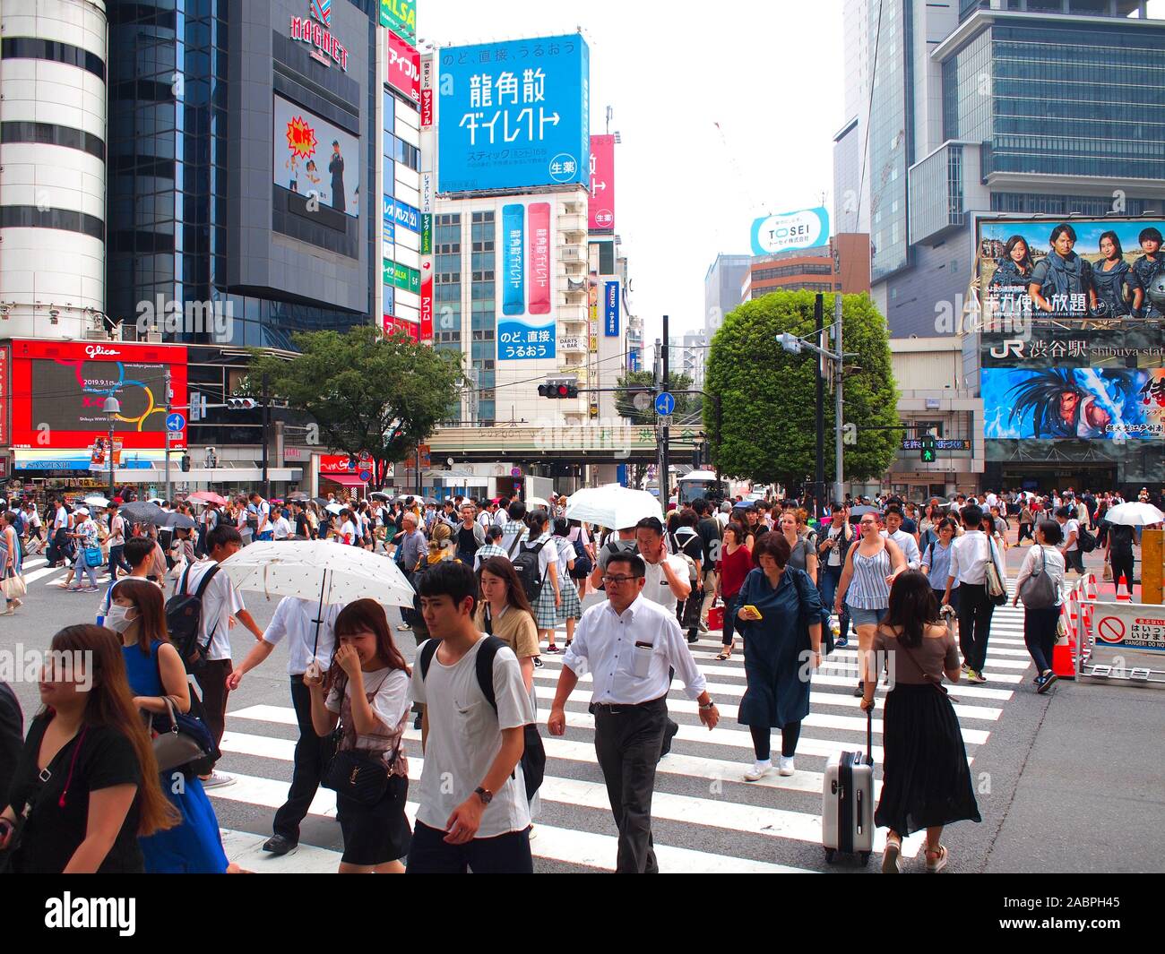 SHIBUYA, TOKYO, JAPAN - August 2nd, 2019: Shibuya crossing with lots of pedestrians. The Shibuya crossing is a popular travel destination. Stock Photo