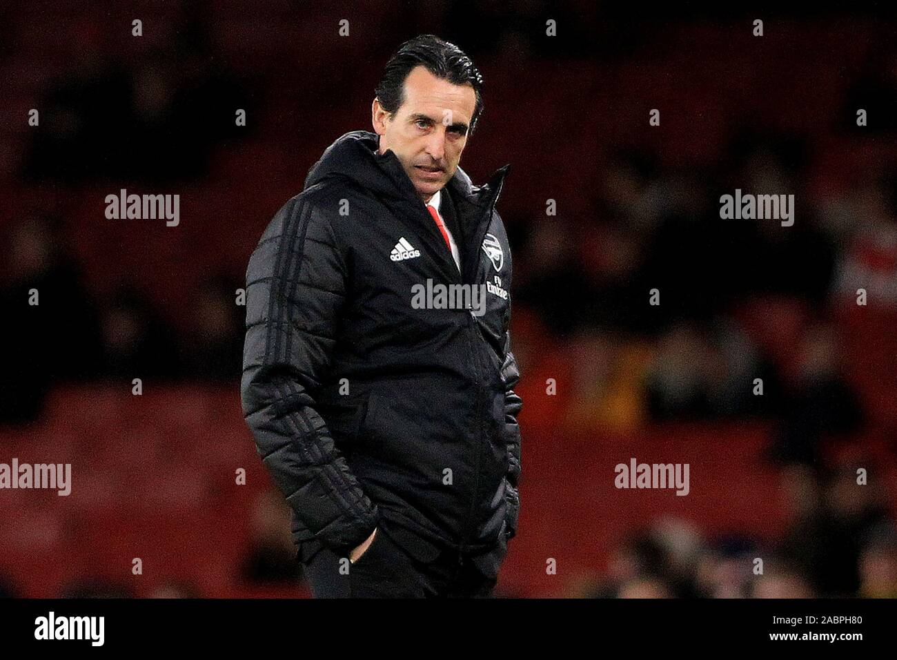 London, UK. 28th Nov, 2019. Arsenal Head Coach Unai Emery looks on from the  touchline wearing his black coat early in the game. UEFA Europa league  group F match, Arsenal v Eintracht