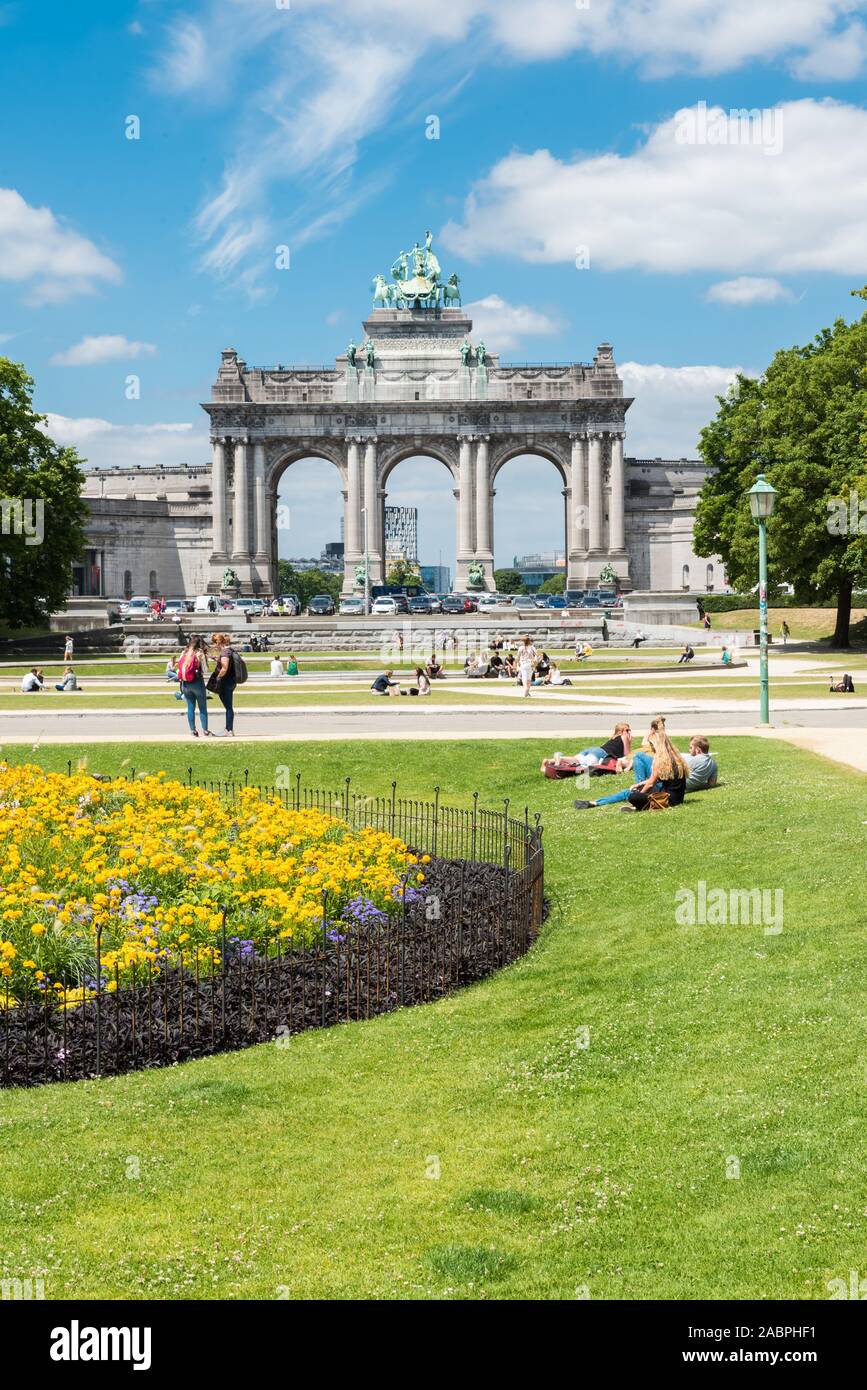 Brussels/ Belgium - 07 03 2019: The cinquentenaire city park with a fountain, colorful flowers and the symbolic arcades in the background Stock Photo