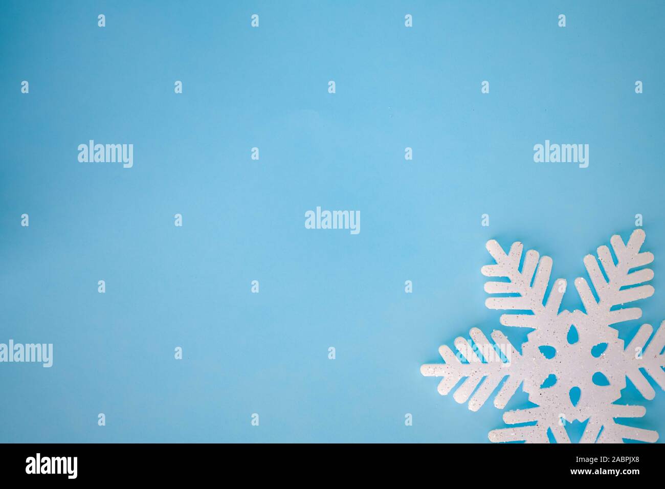 Winter Christmas Background with white snowflakes on blue backdrop ...