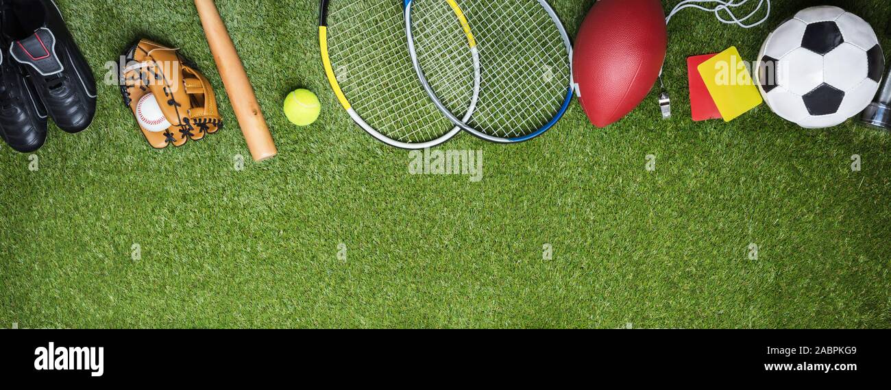 High Angle View Of Different Sports Balls And Equipment Fake Green Turf Grass Backdrop Stock Photo