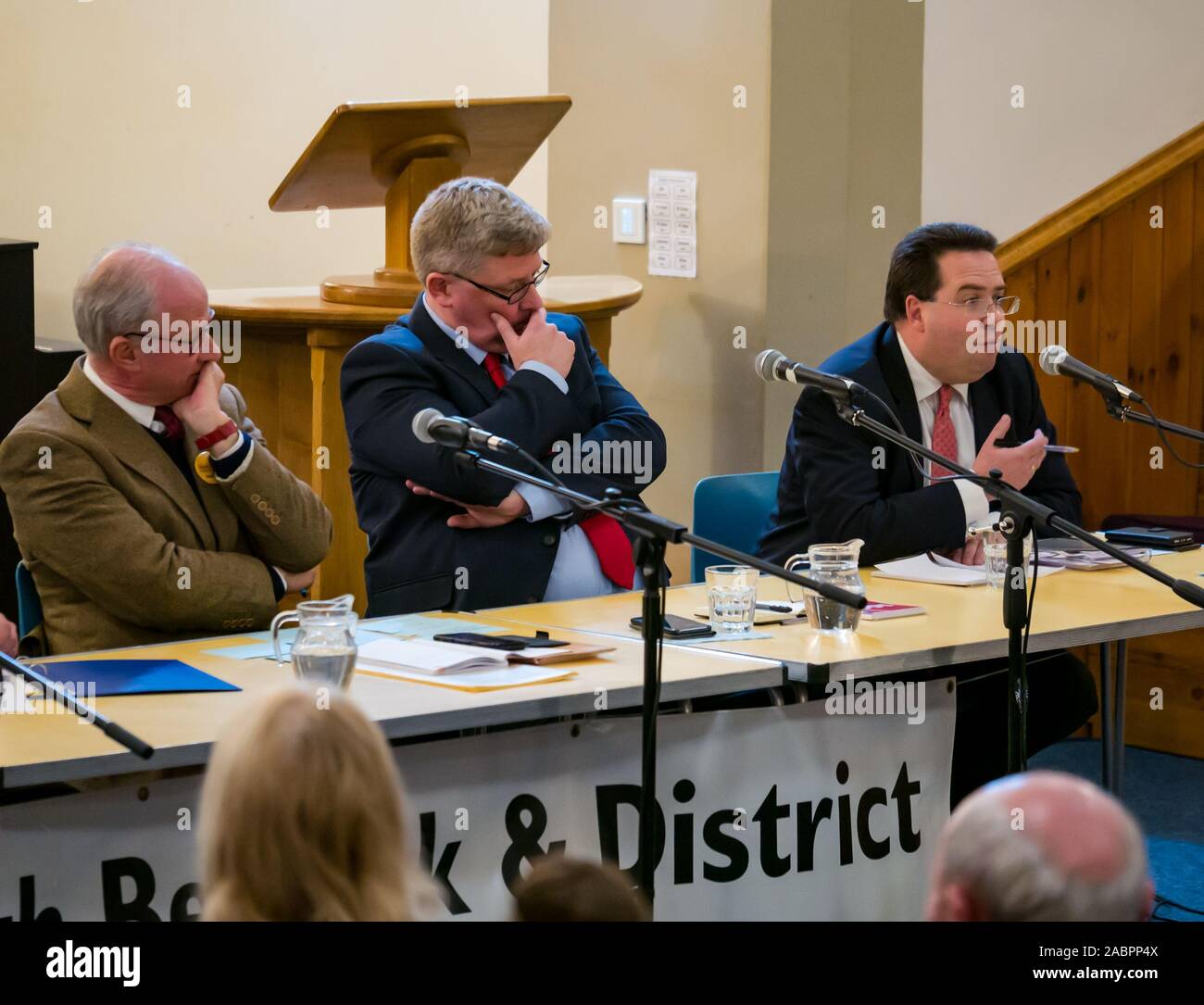North Berwick, East Lothian, Scotland, United Kingdom, 28 November 2019. General Election: First hustings for candidates seeking election as MP for East Lothian with questions from the audience rating fro Defence to Honesty. Pictured (L to R) Robert O'Riordan, Scottish Liberal Democrats candidate, sitting MP Martin Whitfield, Scottish Labour Party candidate, Haddington and Lammermuir ward councillor Craig Hoy, Scottish Conservative & Unionist Party candidate Stock Photo