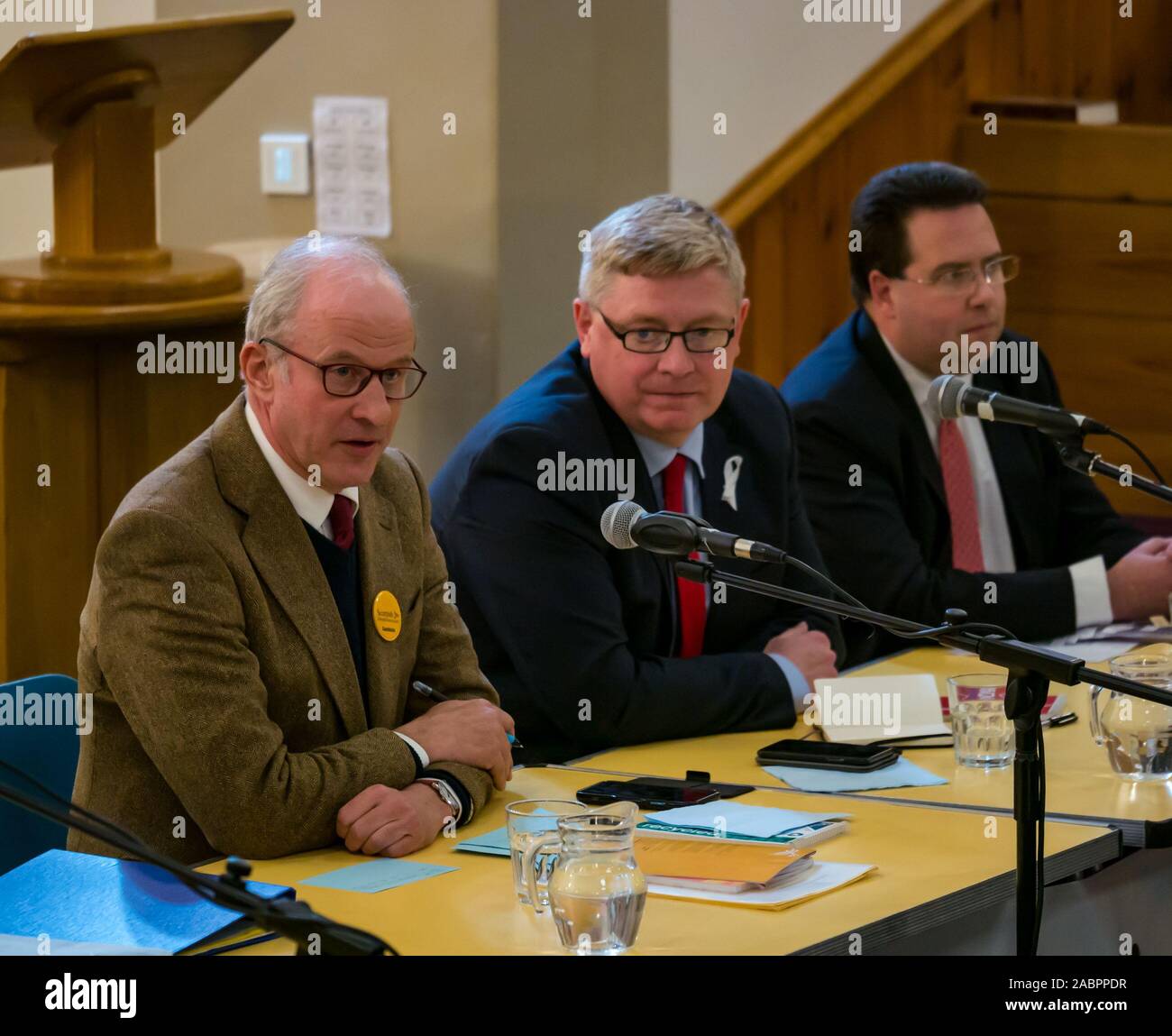 North Berwick, East Lothian, Scotland, United Kingdom, 28 November 2019. General Election: First hustings for candidates seeking election as MP for East Lothian with questions from the audience ranging from Defence to Honesty. Pictured (L to R): Robert O'Riordan, Scottish Liberal Democrats candidate, sitting MP Martin Whitfield, Scottish Labour Party candidate, Haddington and Lammermuir ward councillor Craig Hoy, Scottish Conservative & Unionist Party candidate Stock Photo