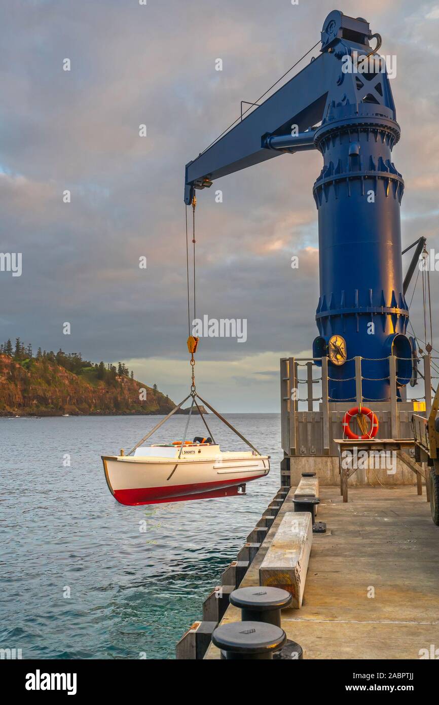 Lighter being launched in Cascade Bay for offloading supplies brought by ship that due to the rugged coastline must anchor some way offshore. Stock Photo