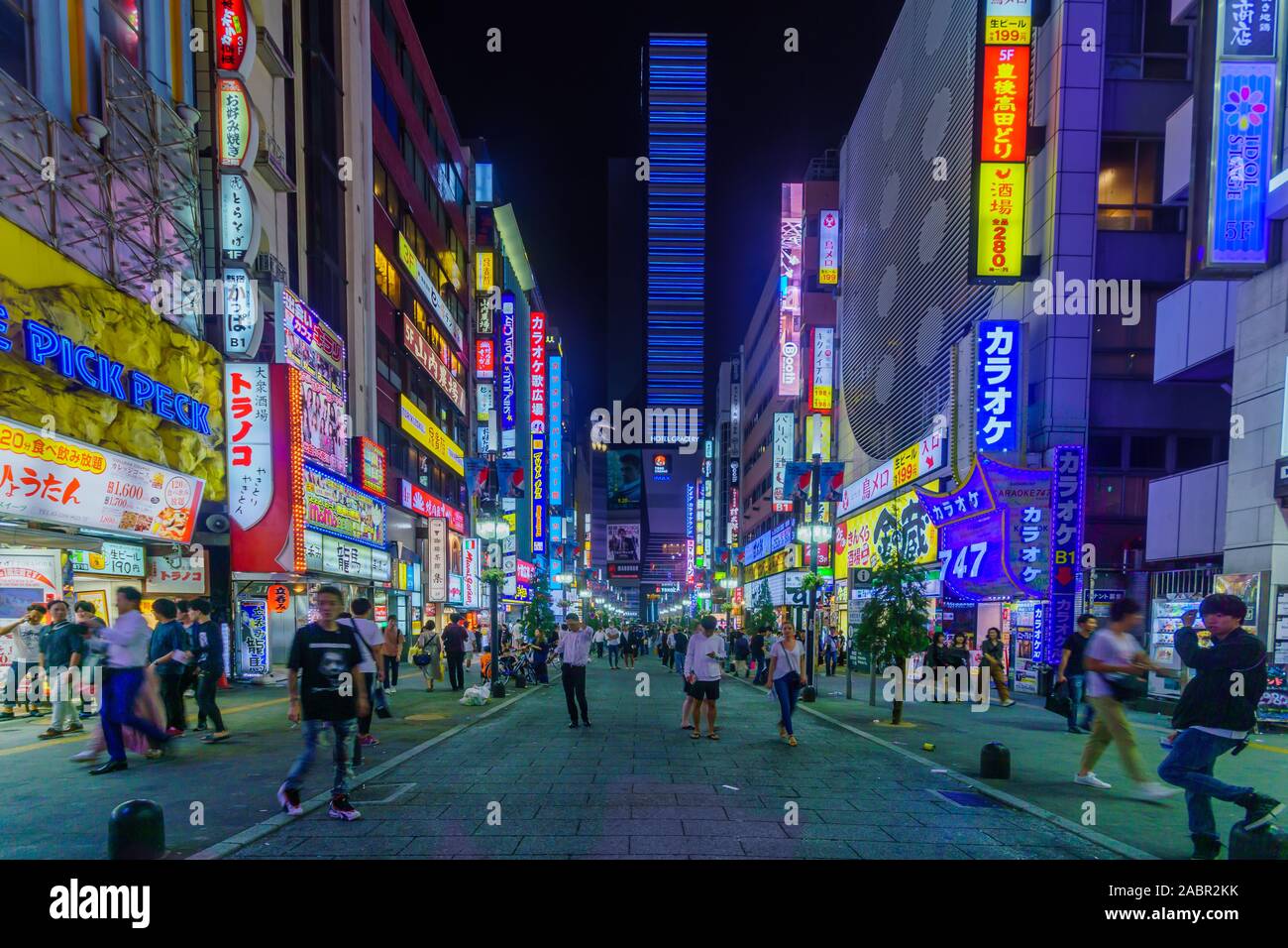 Tokyo, Japan - September 29, 2019: Evening scene of Yasukuni-dori street in Shinjuku, with business neon lights and crowd, in Tokyo, Japan Stock Photo