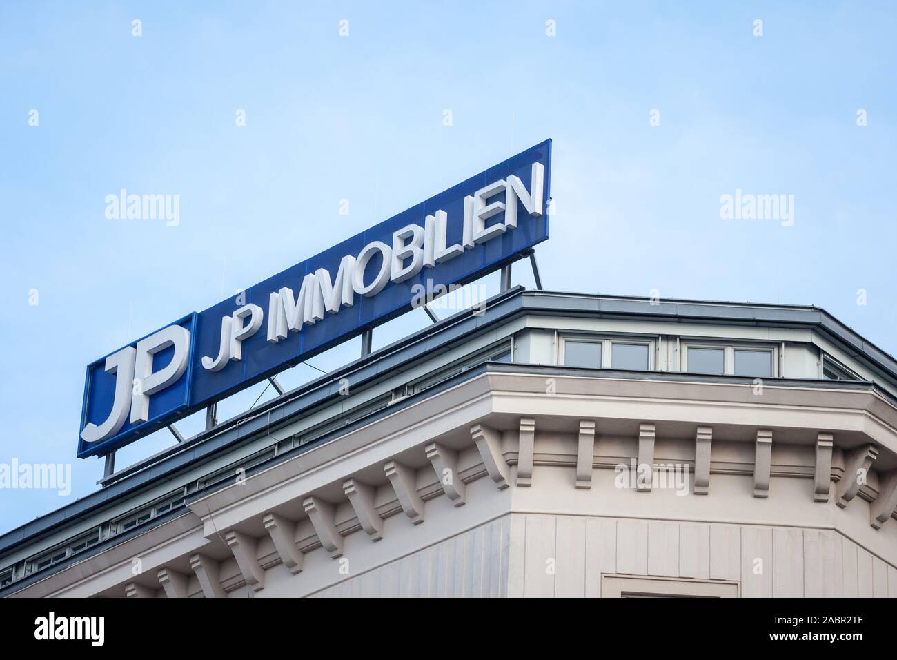 VIENNA, AUSTRIA - NOVEMBER 6, 2019: JP Immobilien logo in front of their main office in Vienna at night. JP Immobilien is one of biggest Real estate a Stock Photo
