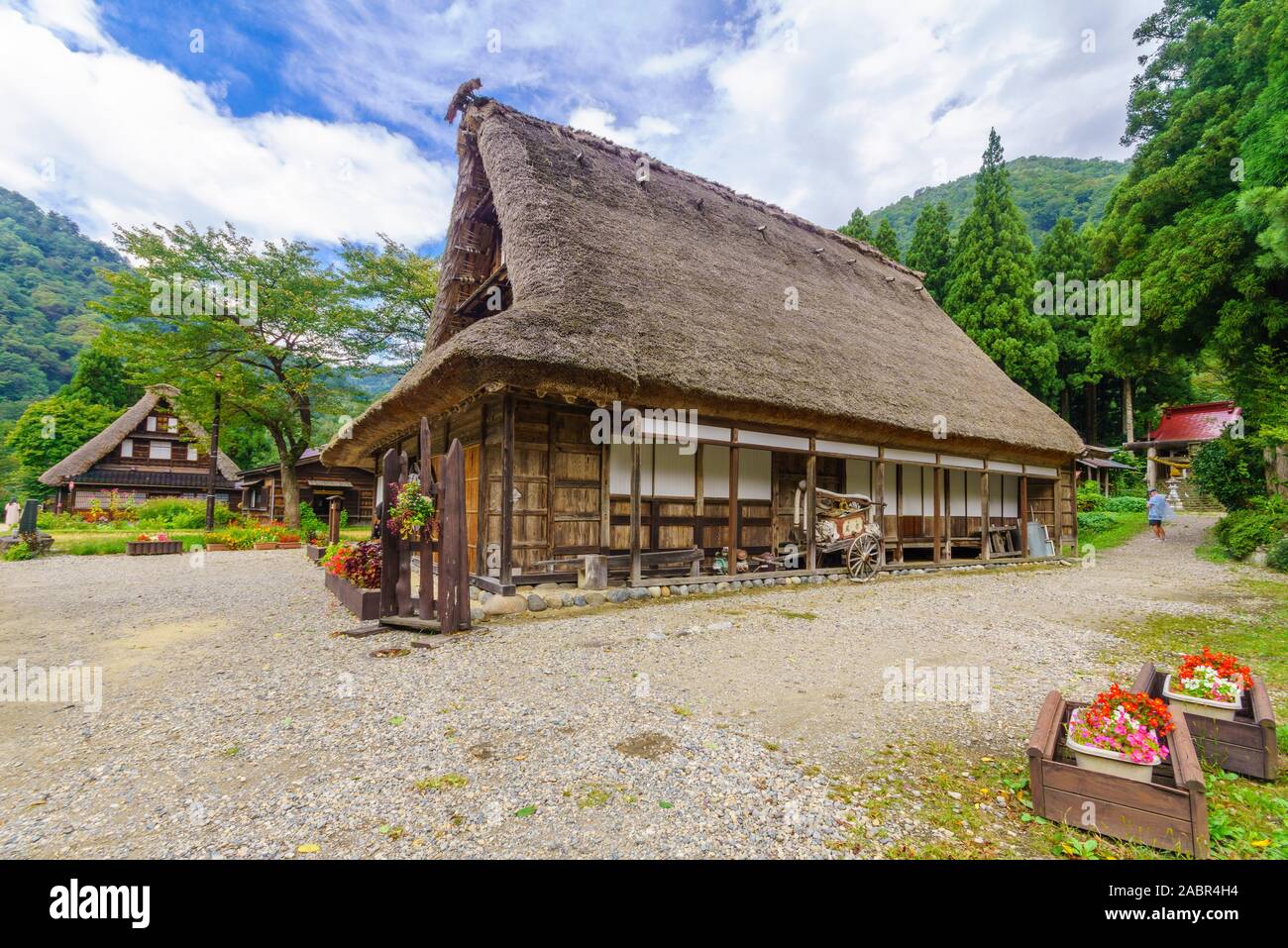 Suganuma, Japan - October 3, 2019: View of traditional gassho-zukuri farmhouses, with locals and visitors, in Suganuma village, Gokayama, Nanto, Japan Stock Photo