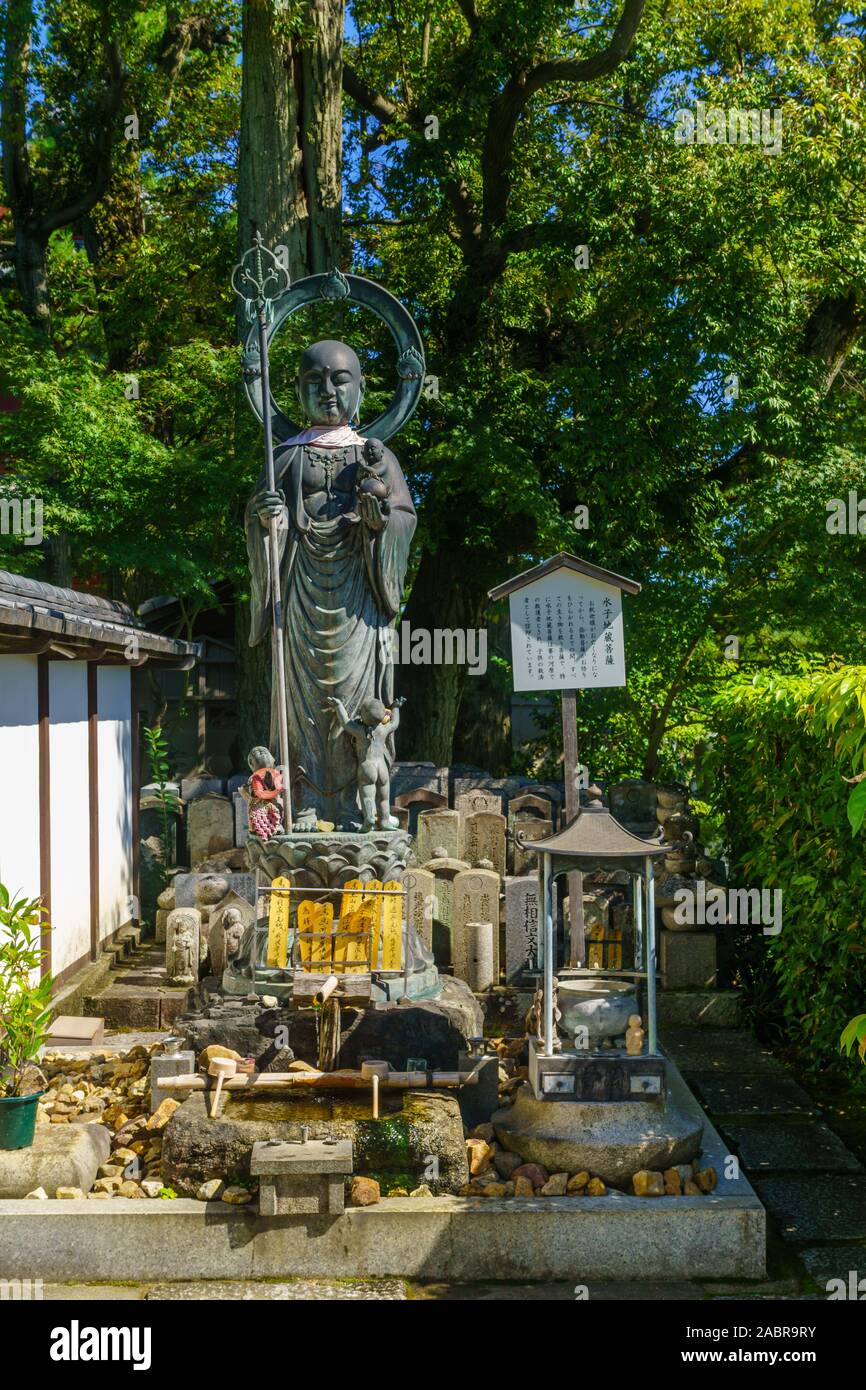 Kyoto, Japan - October 9, 2019: View of statue and graves in the cemetery of the Taizo-in Temple, in Kyoto, Japan Stock Photo