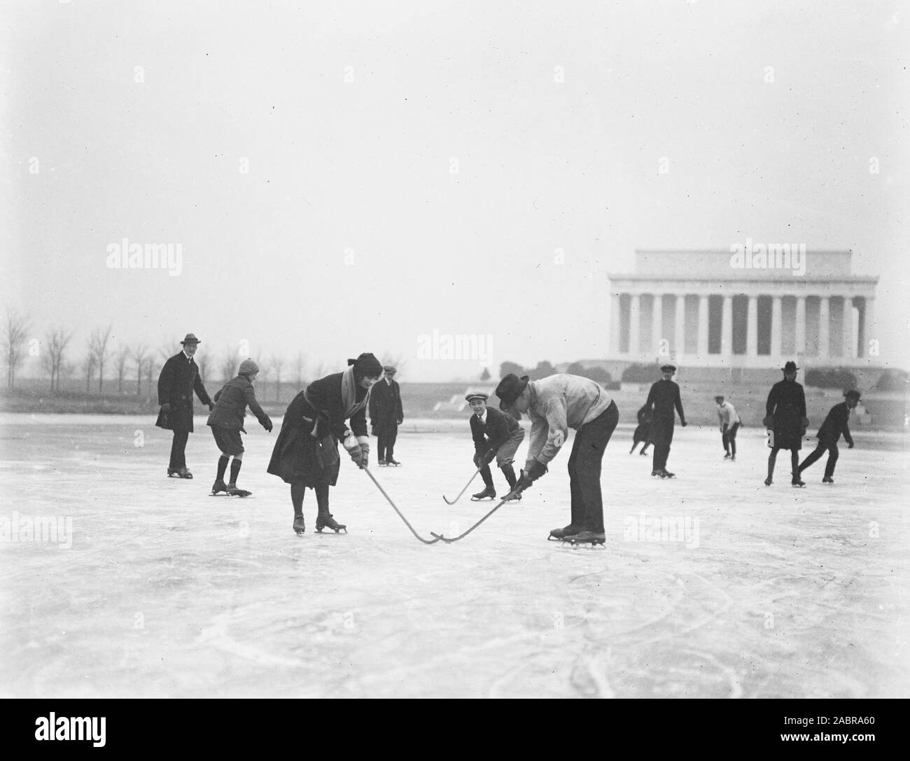 Ice skaters with hockey sticks in front of the Lincoln Memorial in Washington D.C. ca. January 1922 Stock Photo