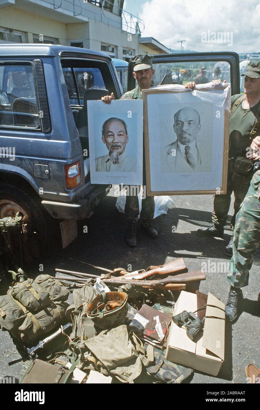 U.S. Marines display portraits of Ho Chi Minh and Vladimir Ilyich Lenin that were seized at Pearls Airport during the multi-service, multinational Operation Urgent Fury in Grenada. Stock Photo
