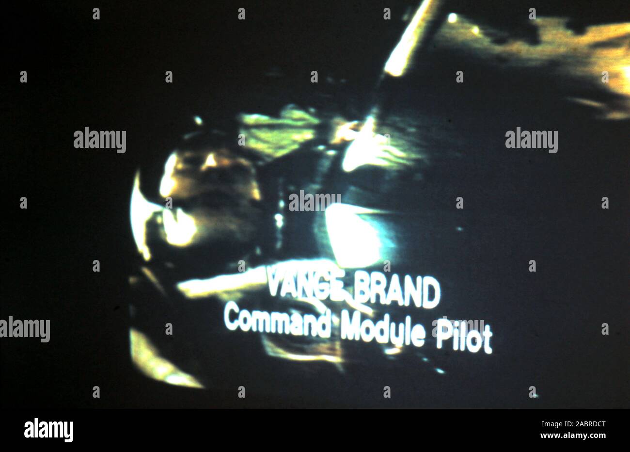 Teleclip - Apollo-Soyuz Test Project - 'Vance Brand - Command Module Pilot' subtitles; - Soyuz 19 docked with Apollo CSM-111 - photo taken directly from color TV screen in the UK - by 'Harry' (the unknown photographer) during the live broadcasts in July 1975.  The Apollo–Soyuz Test Project (ASTP) (Russian: Экспериментальный полёт «Аполлон» – «Союз» (ЭПАС), Eksperimentalniy polyot Apollon-Soyuz, lit. 'Experimental flight Apollo-Soyuz', commonly referred to by the Soviets as Soyuz–Apollo), conducted in July 1975. Stock Photo