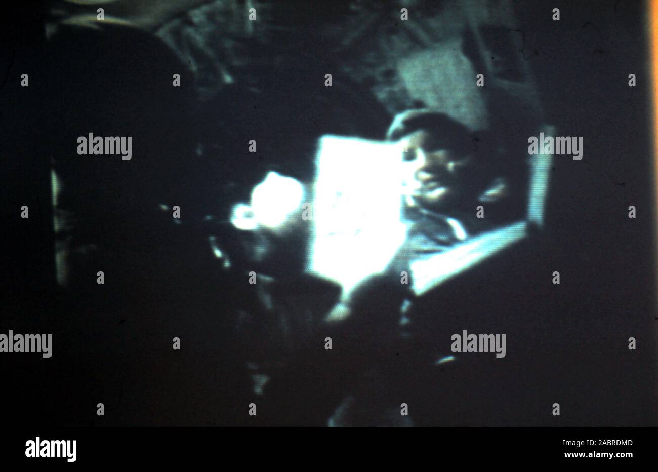 Teleclip Apollo Soyuz Test Project - Alexei Leonov inside Soyuz 19 spacecraft - photo taken directly from color TV screen in the UK - by 'Harry' (the unknown photographer) during the live broadcasts in July 1975.  The Apollo–Soyuz Test Project (ASTP) (Russian: Экспериментальный полёт «Аполлон» – «Союз» (ЭПАС), Eksperimentalniy polyot Apollon-Soyuz, lit. 'Experimental flight Apollo-Soyuz', commonly referred to by the Soviets as Soyuz–Apollo), conducted in July 1975. Stock Photo