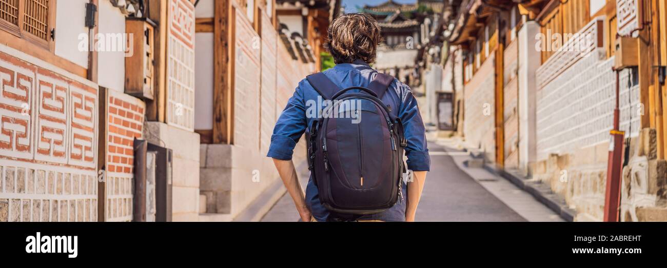 Young man tourist in Bukchon Hanok Village is one of the famous place ...