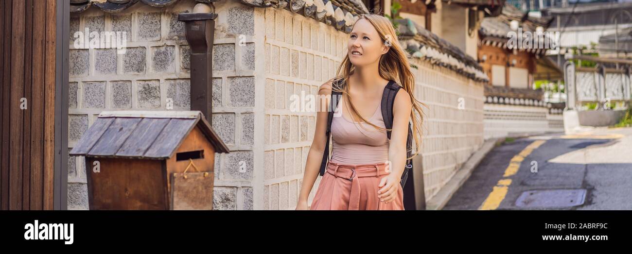 Young woman tourist in Bukchon Hanok Village is one of the famous place ...
