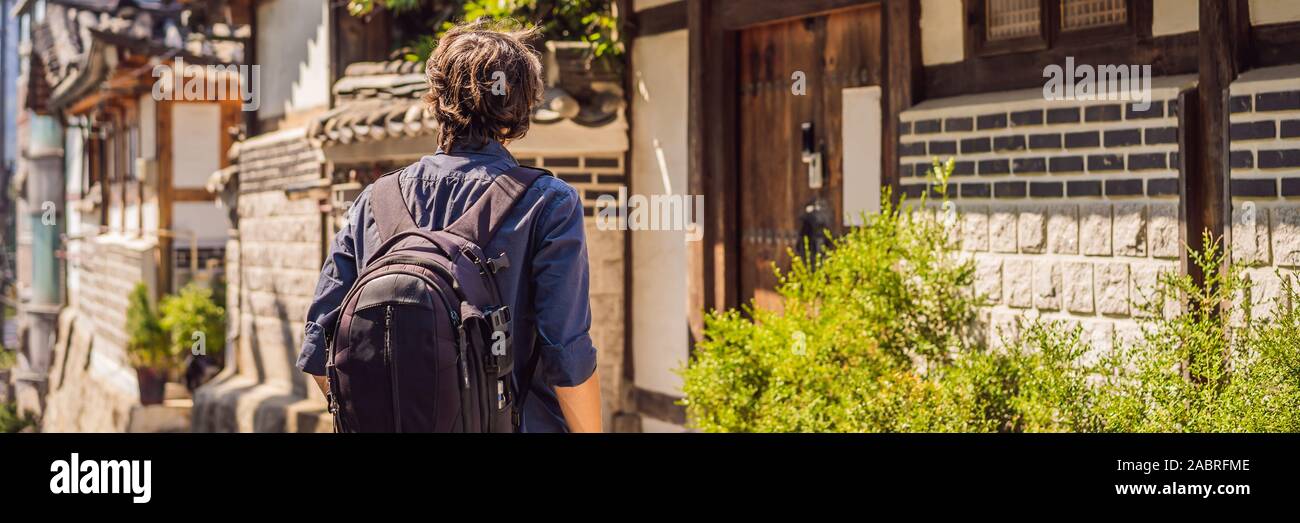 Young man tourist in Bukchon Hanok Village is one of the famous place ...