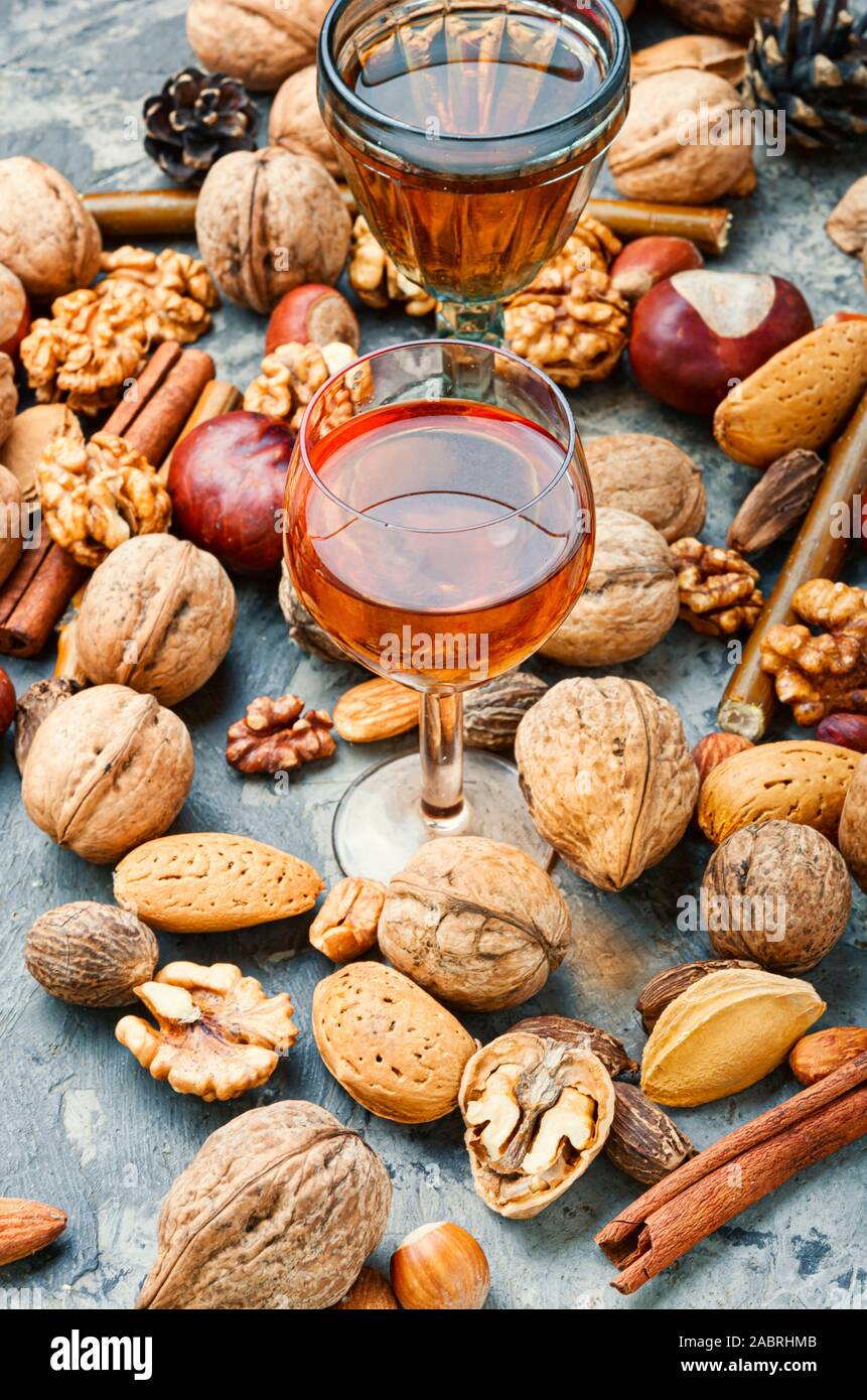 Glass with aromatic alcohol from nuts.Fragrant nutty liquor tincture