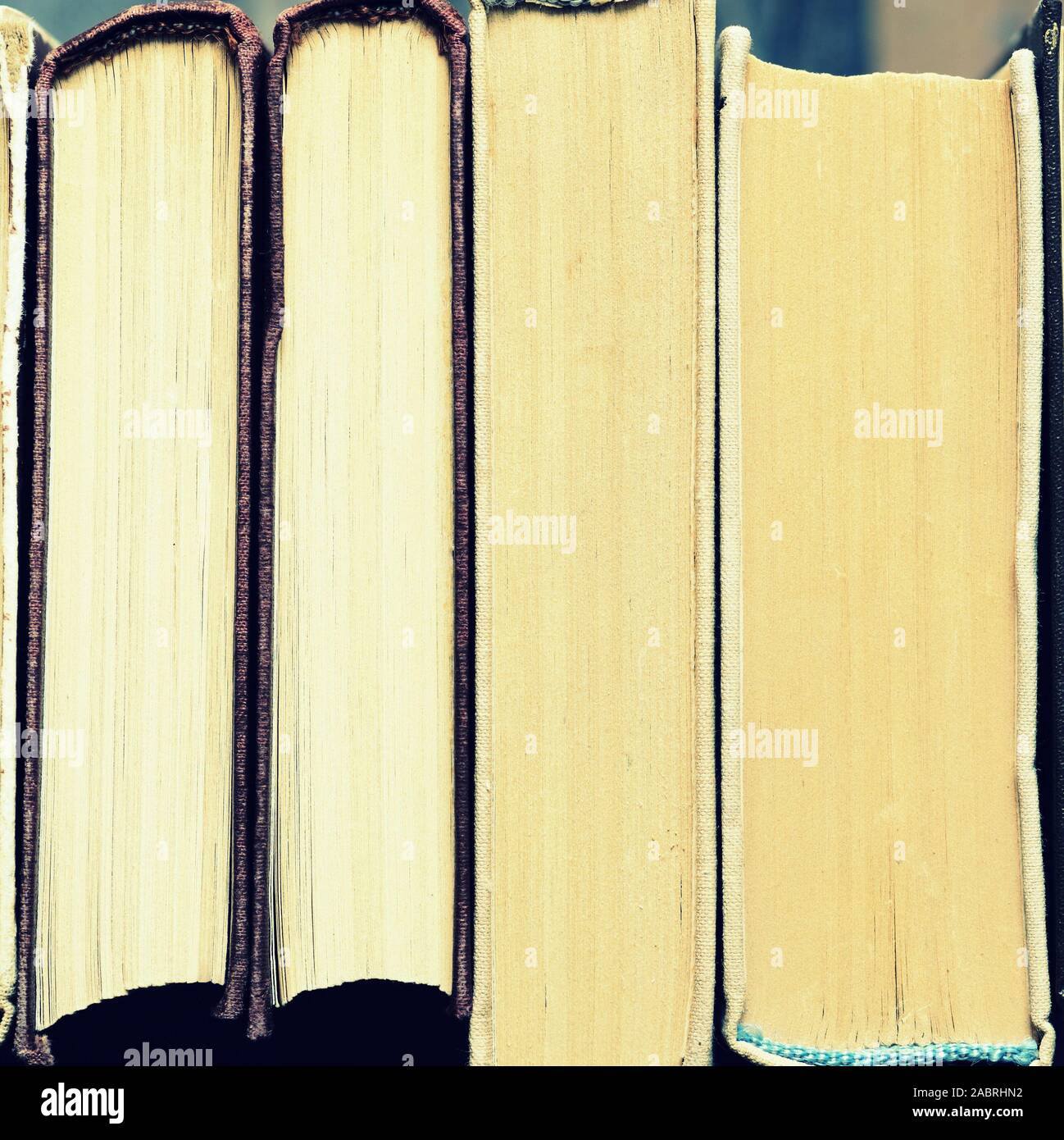 Old books stacked closeup. Toned educational background, square shape ...