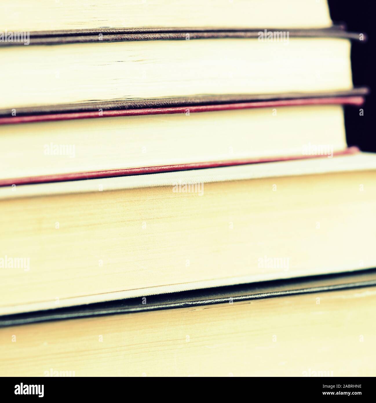 Old books stacked closeup. Toned educational background, square shape ...