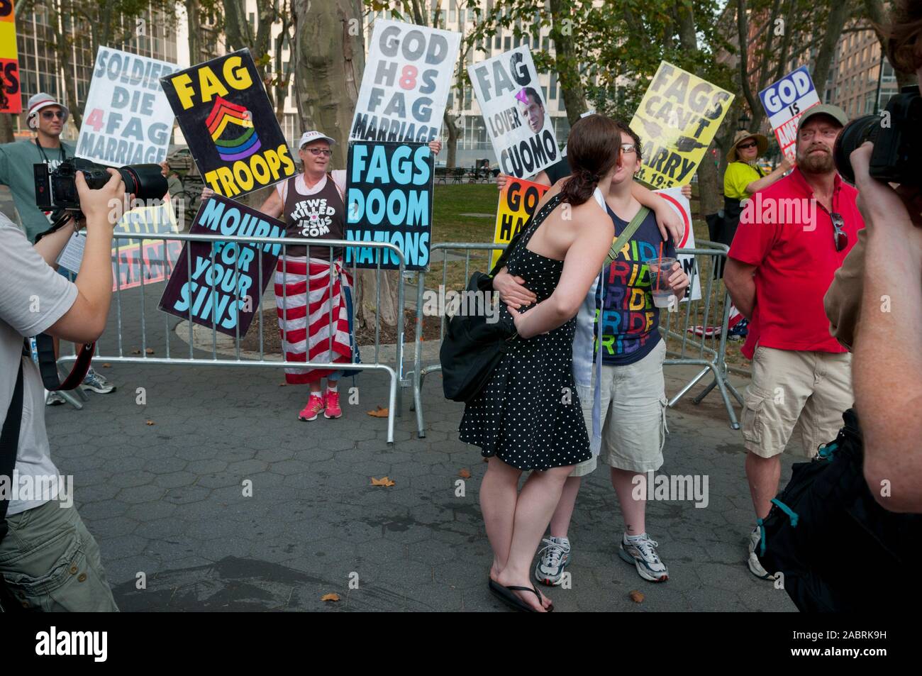 Lesbian couple and Westboro Baptist Church picketers outside the Manhattan City Clerk's office on the first day of legal same-sex marriage in New York Stock Photo