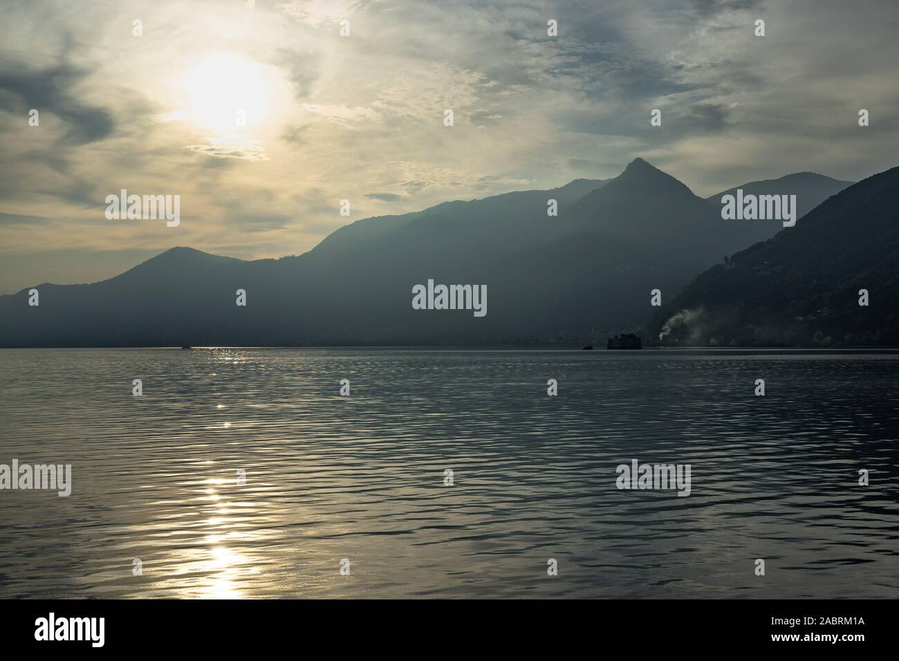 Scenic view of the Lake Maggiore at sunset on ferry boat cruising from Cannobio to Cannero Riviera, Piedmont, Italy Stock Photo