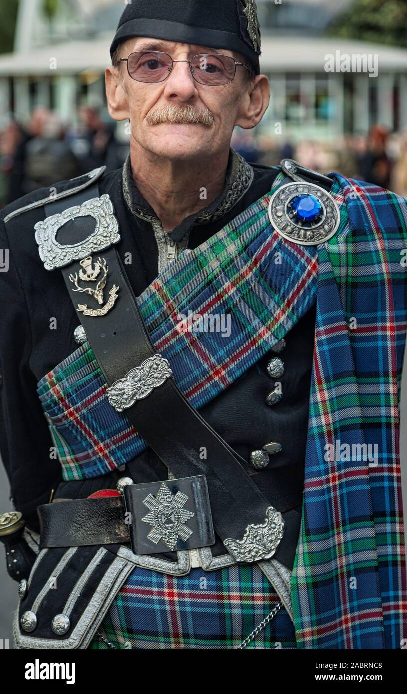 War veteran bagpipe player in traditional outfit Stock Photo Alamy
