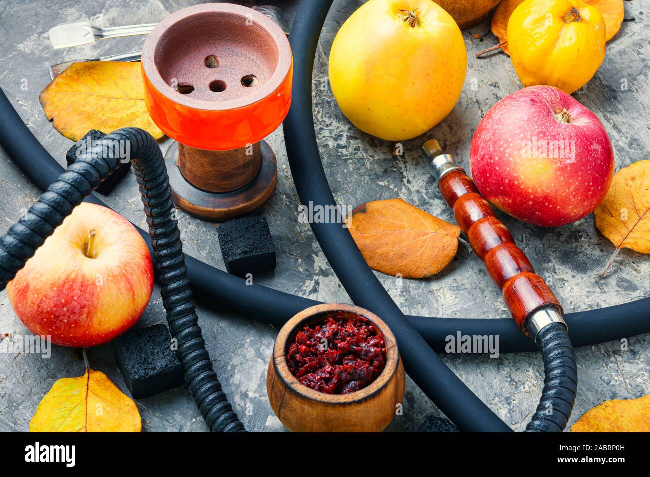 Oriental smoking shisha.Hookah bowl and tobacco.Details of Turkish nargile.Kalian  tobacco with apple aroma and quince Stock Photo