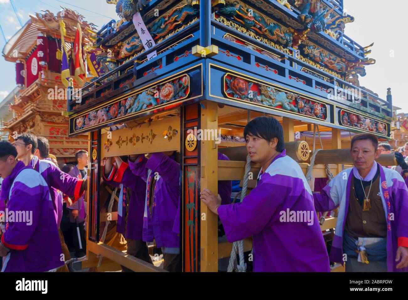 Saijo, Japan - October 16, 2019: Parade with participants carrying Danjiri floats (portable shrines), in the streets of the city center. Saijo Isono S Stock Photo